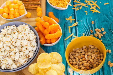 Beer salty snacks on wooden table