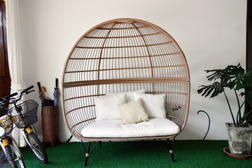 Living room interior with birdcage sofa, soft and selective focus.