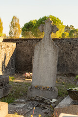 Close-up of an old, weather-worn gravestone in a cemetery
