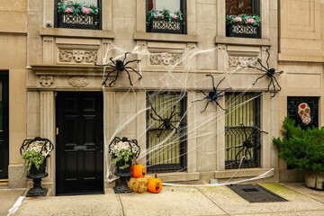 Front of apartment building decorated with spider web for Halloween holiday in Manhattan New York. High-quality photo