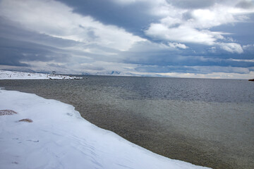 Snow-covered shore of the lake