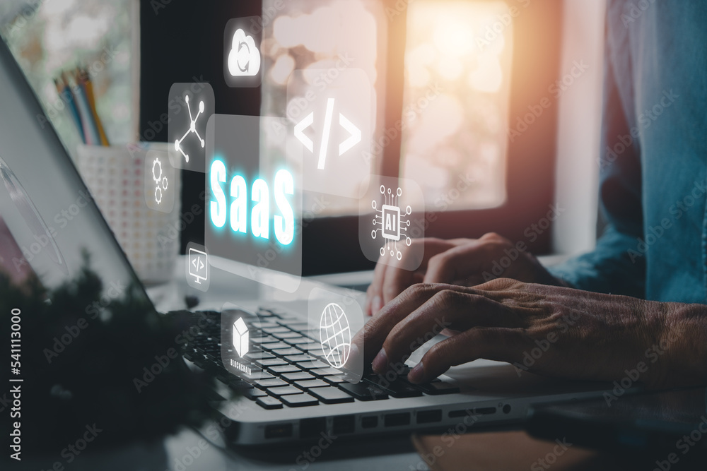 Aufkleber saas - software as a service, businessman hand working on laptop to synchronize on saas host server 