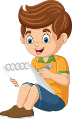 Cartoon little boy sitting and writing on notebook