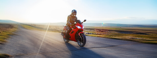 Motorcyclist rides on the road