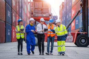 Professional container yard workers and co-worker having discussion on working plan together,Cargo Shipping Import and Export industry.