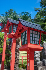 Traditional wooden Japanese lamp 
at Sanko Inari Shrine at Inuyama Castle with blue sky background