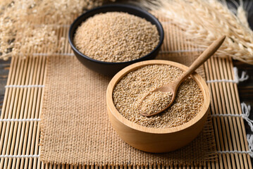 Brown quinoa seed in wooden bowl with spoon, Super food