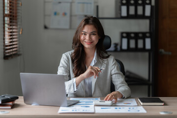 Beautiful asian businesswoman working in office. business finance concept