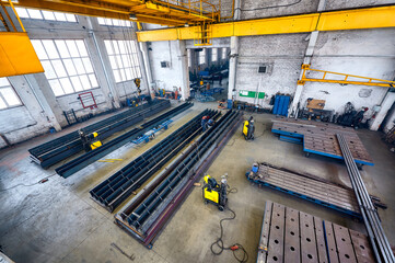 Long steel constructions assembling with welding in workshop