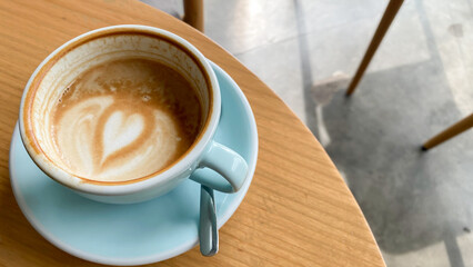 close up blue cup of coffee on the table