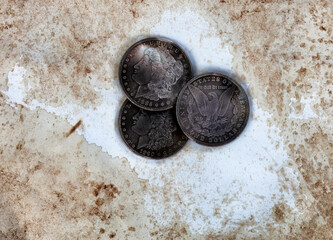 Vintage silver coins on faded paper