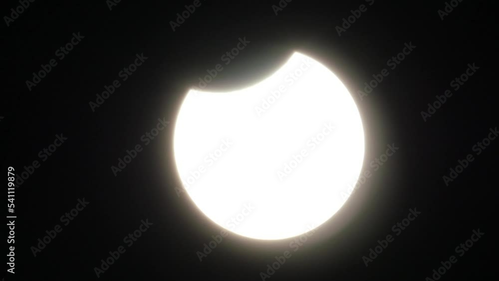 Wall mural partial solar eclipse with a clear view of the sky and no clouds - oct. 25, 2022