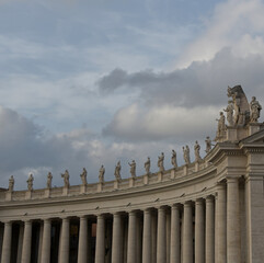 A close up shot of the statues that surround Saint Peter's square at the Vatican in Rome Italy.