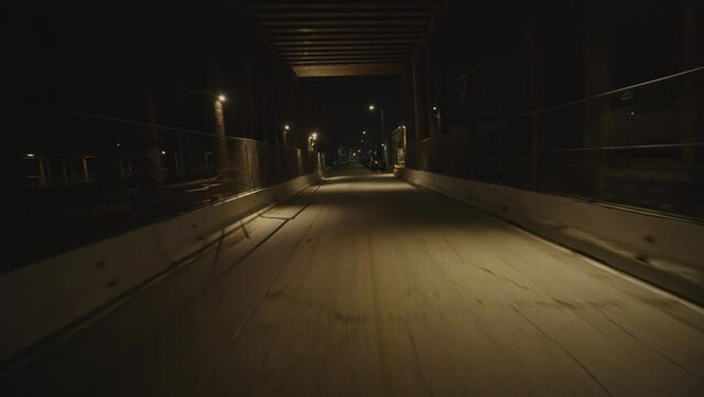 FPV drone shot down a dark alley at night