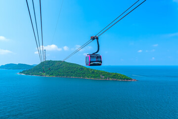 View of longest cable car ride in the world, Phu Quoc island, Vietnam. Below is seascape with tropical islands and boats. © huythoai