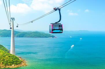 View of longest cable car ride in the world, Phu Quoc island, Vietnam. Below is seascape with tropical islands and boats.