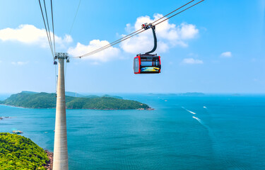 View of longest cable car ride in the world, Phu Quoc island, Vietnam. Below is seascape with tropical islands and boats. © huythoai