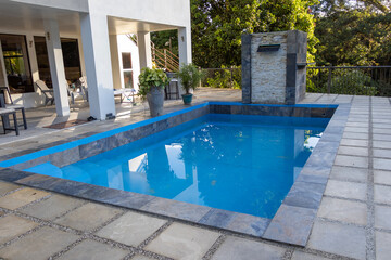 swimming pool in hotel, Blue swimming pool in vacation spot during the day