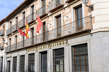 Facade of a public building with the following in Spanish: Council of the Finance, Tax Agency. In Alcala de Henares, Madrid, Spain