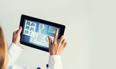 Close of female doctor hands working with tablet pc computer