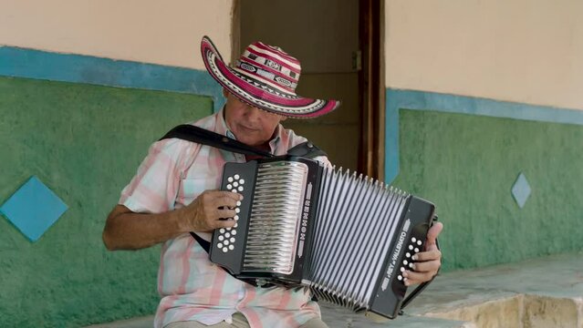 Man playing the accordion on his beloved town.