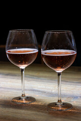 two glasses of champagne close-up on a dark background