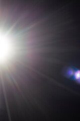 refracted sun rays on a black background