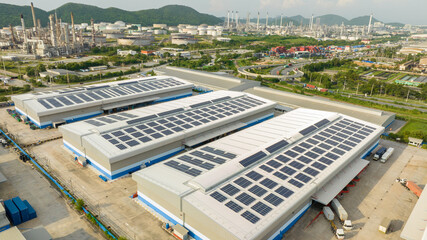 Top view Solar Cell on Warehouse Factory. Solor photo voltaic panels system power or Solar Cell on industrial building roof for producing green ecological electricity. Production of renewable energy.