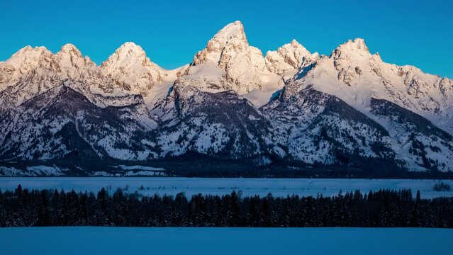 Time-lapse of sunrise light working down the mountain faces in Grand Teton National Park.  Shot on 4K