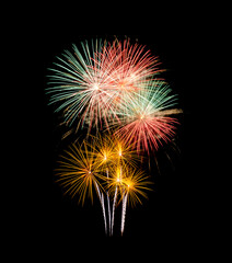 Festive new years colorful fireworks on black background for celebration and anniversary .