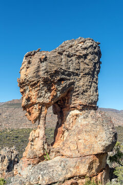 Rock formation, resembling a womans face and hand