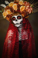 Fototapeta na wymiar Portrait in studio of Drag Queen catrin. Colorful portrait of catrina with flower crown.