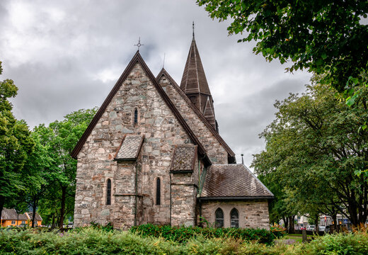 Voss Church in the village of Vossevangen (or Voss), in Vestland County, Norway. This gray, stone church was built in a long church design in 1277.
