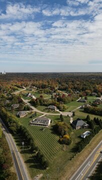 Aerial View Of Suburban Ohio Surrounded By Buildings And Dense Trees