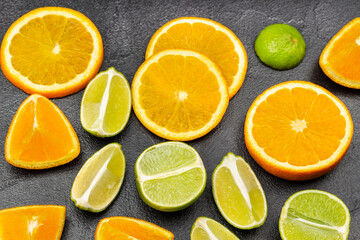 Natural source of strengthening immunity. Slices of orange and lime on the table.