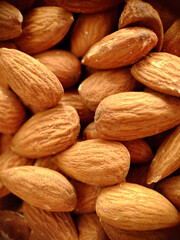 A handful of large almonds close-up selective focus