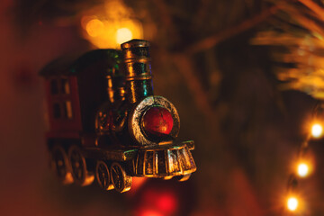 Fototapeta na wymiar Toys on the Christmas tree. Fabulous steam train