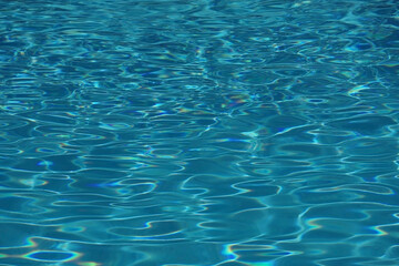 Light reflecting on the water surface of a swimming pool