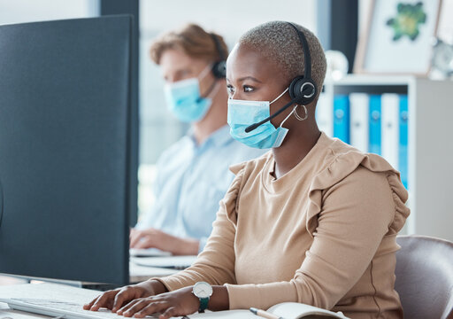 Black woman, call center and face mask for covid, headphones and phone call with client, customer service or telemarketing sales job. Contact us, consultant and tech support, health safety at work.