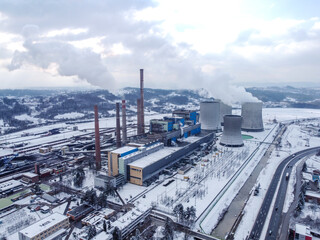 Air pollution. Aerial drone view of chimneys in factory blowing pollution in environment. Huge thermal power plant. Industrial air pollution from smokestacks.  Industry. 