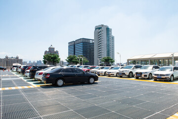  Outdoor parking lot with modern  buildings and sky background.