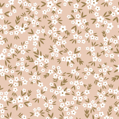 Cute floral pattern in a small flower. Seamless vector texture. An elegant template for fashionable prints. Printing with small white flowers. Beige background.