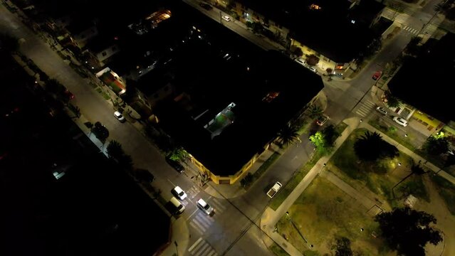 Nighttime at Traditional Santiago neighborhood, Street Urban grid, Drone flyover. Chile
