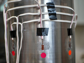 extensiometry gauges, strain gauges glued on a metal sample.