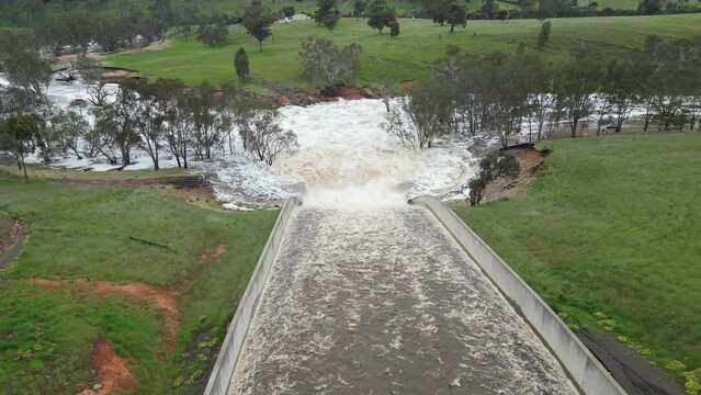 Lake Eppalock dam spillway overflowing into the Campaspe River near Bendigo after heavy spring rain 2022