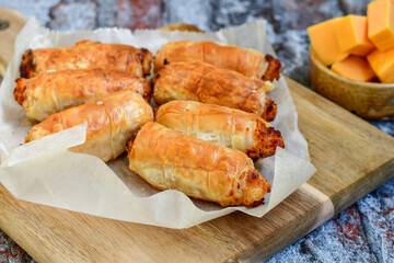  Greek style Mini filo pastry rolls with bacon and cheddar cheese .Home made bakery .Fresh baked  Mini cheese  ,meat and herbs puff pastries