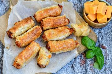  Greek style Mini filo pastry rolls with bacon and cheddar cheese .Home made bakery .Fresh baked  Mini cheese  ,meat and herbs puff pastries