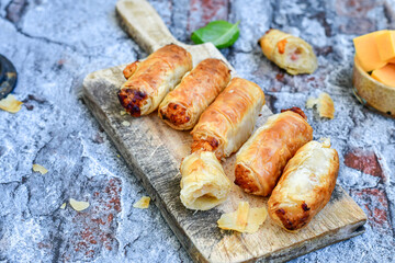  Greek style Mini filo pastry rolls with bacon and cheddar cheese .Home made bakery .Fresh baked  Mini cheese  ,meat and herbs puff pastries