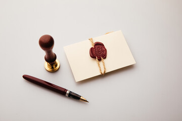Envelope, wax stamp and pen. Postal accessories