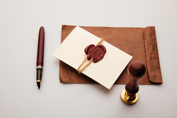 Paper envelope with wax stamp on a table